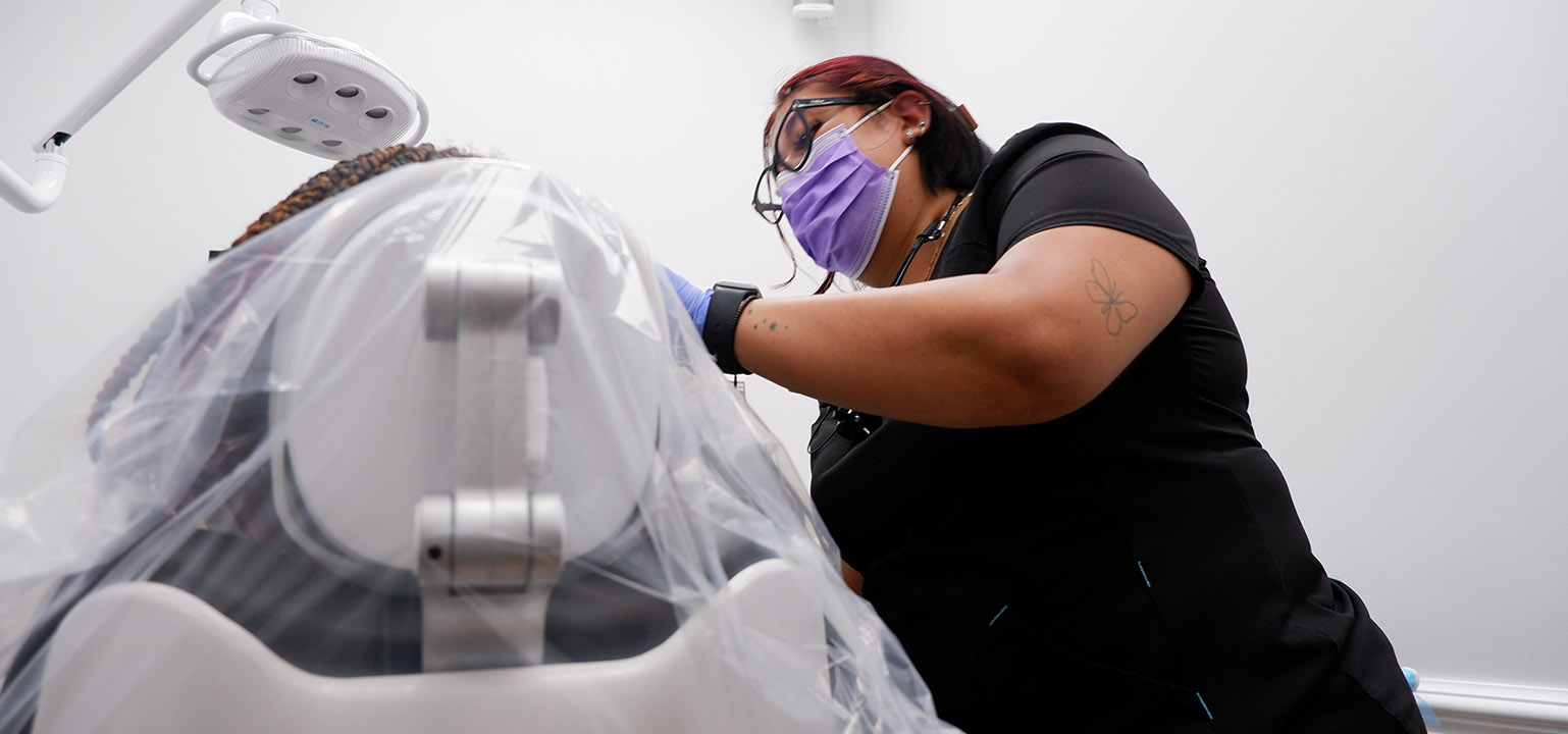 Ultra Dental team member caring for a patient